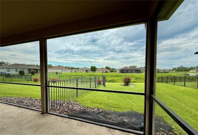 7318 61st St E, Palmetto, FL 34221 - unfurnished sunroom with a residential view