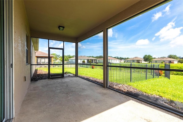 7318 61st St E, Palmetto, FL 34221 - unfurnished sunroom featuring a residential view
