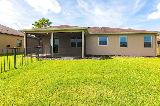 7318 61st St E, Palmetto, FL 34221 - back of property with a sunroom and stucco siding