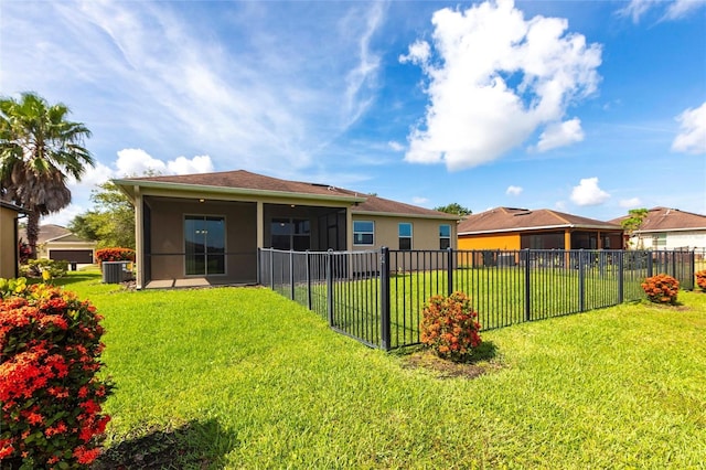 7318 61st St E, Palmetto, FL 34221 - back of property with a sunroom, a fenced backyard, and stucco siding