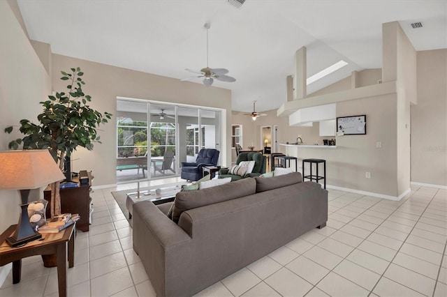 102 Marker Rd, Rotonda West, FL 33947 - living area featuring a ceiling fan, vaulted ceiling, and light tile patterned floors