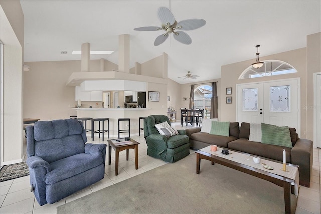 102 Marker Rd, Rotonda West, FL 33947 - living room featuring ceiling fan, light tile patterned floors, high vaulted ceiling, and french doors