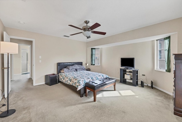 102 Marker Rd, Rotonda West, FL 33947 - carpeted bedroom with baseboards and ceiling fan
