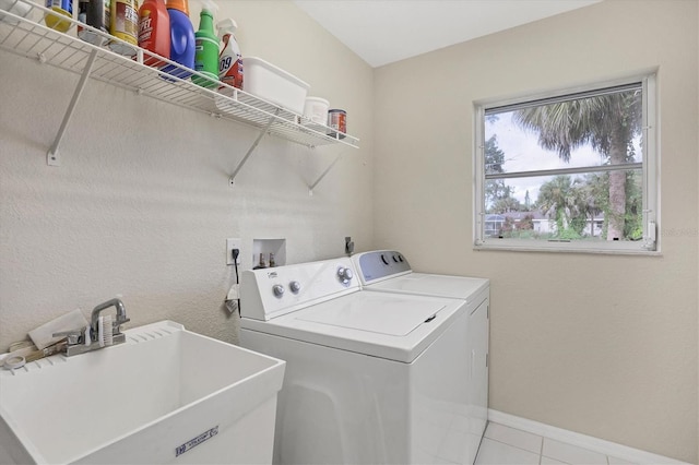 102 Marker Rd, Rotonda West, FL 33947 - washroom with washing machine and dryer and tile patterned floors