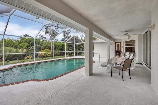 102 Marker Rd, Rotonda West, FL 33947 - swimming pool with ceiling fan, a patio, and glass enclosure