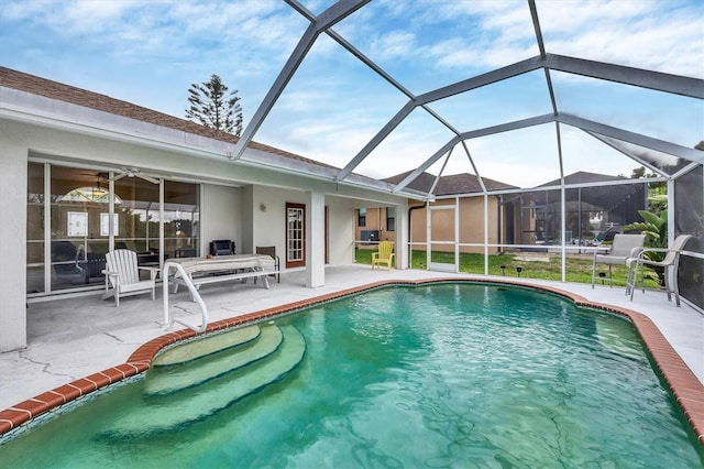 102 Marker Rd, Rotonda West, FL 33947 - swimming pool featuring a patio area and glass enclosure