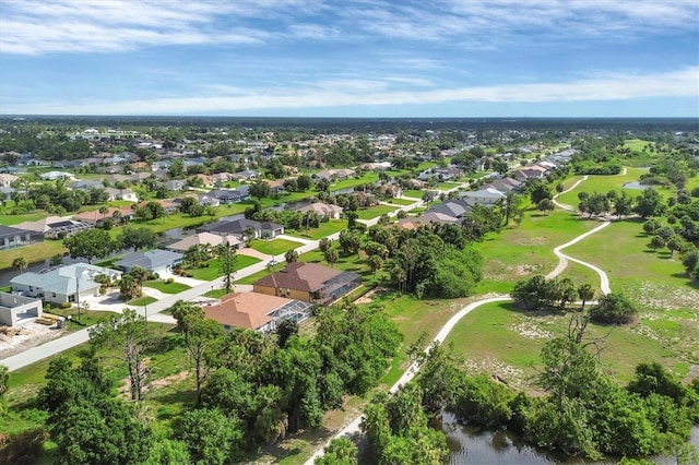 102 Marker Rd, Rotonda West, FL 33947 - aerial view of property and surrounding area with nearby suburban area