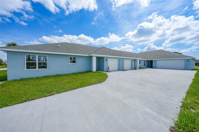 238 Boundary Blvd Unit 3, Rotonda West, FL 33947 - single story home featuring an attached garage, driveway, a front lawn, and stucco siding