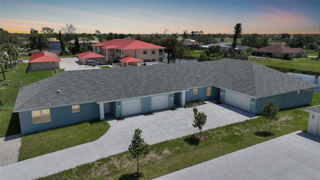 238 Boundary Blvd Unit 3, Rotonda West, FL 33947 - view of front of property featuring an attached garage, a residential view, concrete driveway, and roof with shingles