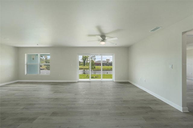 238 Boundary Blvd Unit 3, Rotonda West, FL 33947 - spare room with a ceiling fan and wood finished floors