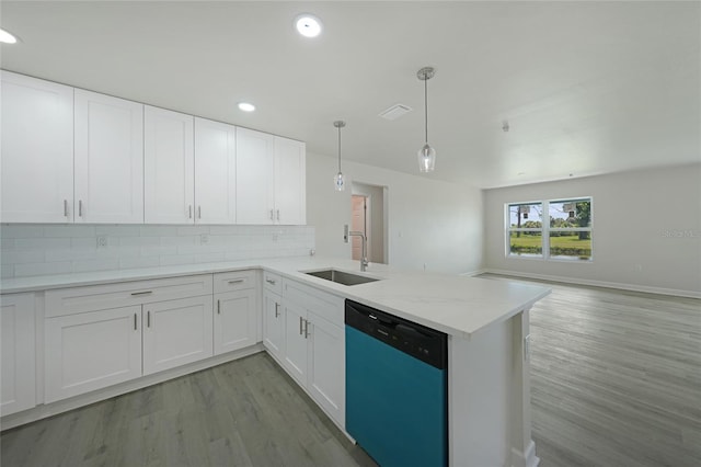 238 Boundary Blvd Unit 3, Rotonda West, FL 33947 - kitchen with dishwasher, light wood-style floors, white cabinetry, backsplash, and recessed lighting