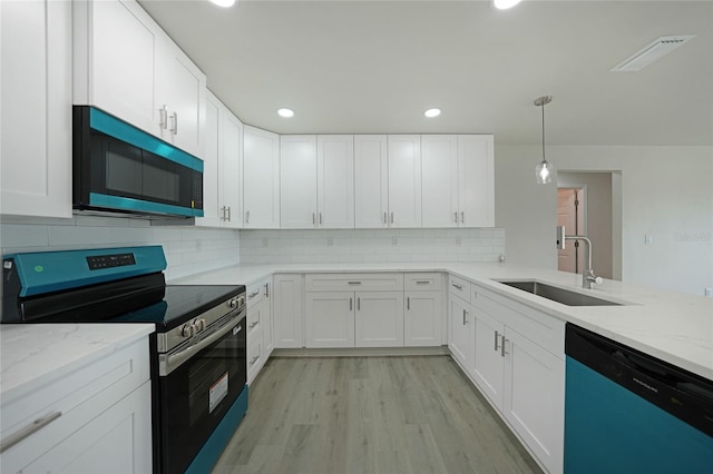 238 Boundary Blvd Unit 3, Rotonda West, FL 33947 - kitchen featuring electric range, dishwasher, white cabinetry, and recessed lighting