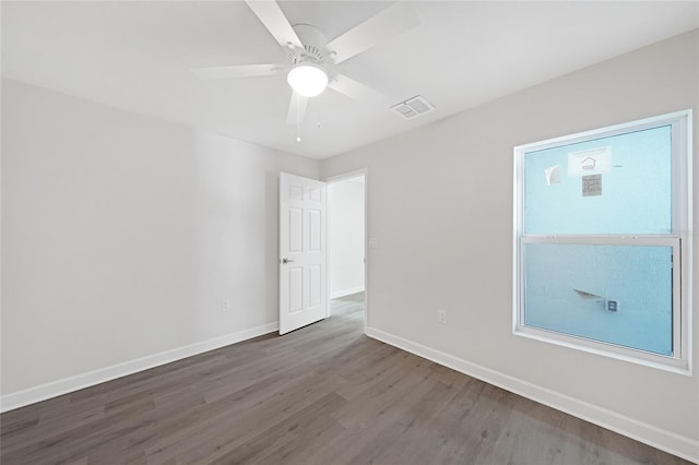 238 Boundary Blvd Unit 3, Rotonda West, FL 33947 - unfurnished room featuring wood finished floors and a ceiling fan