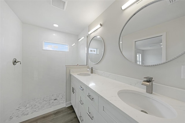 238 Boundary Blvd Unit 3, Rotonda West, FL 33947 - bathroom featuring double vanity, wood finished floors, a walk in shower, and recessed lighting
