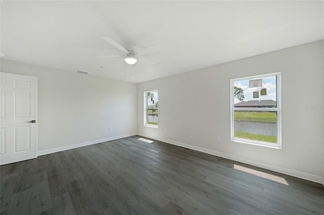 238 Boundary Blvd Unit 3, Rotonda West, FL 33947 - spare room with dark wood finished floors and ceiling fan