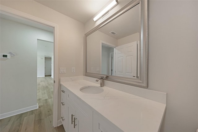 238 Boundary Blvd Unit 3, Rotonda West, FL 33947 - bathroom featuring vanity and wood finished floors