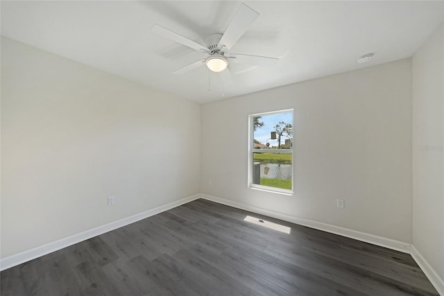 238 Boundary Blvd Unit 3, Rotonda West, FL 33947 - empty room featuring a smoke detector, dark wood-style flooring, and a ceiling fan