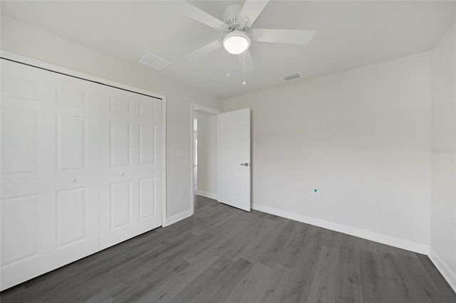 238 Boundary Blvd Unit 3, Rotonda West, FL 33947 - unfurnished bedroom with dark wood-style flooring, a closet, and ceiling fan