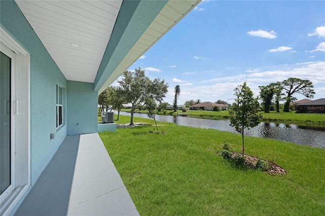 238 Boundary Blvd Unit 3, Rotonda West, FL 33947 - view of grassy yard featuring a water view