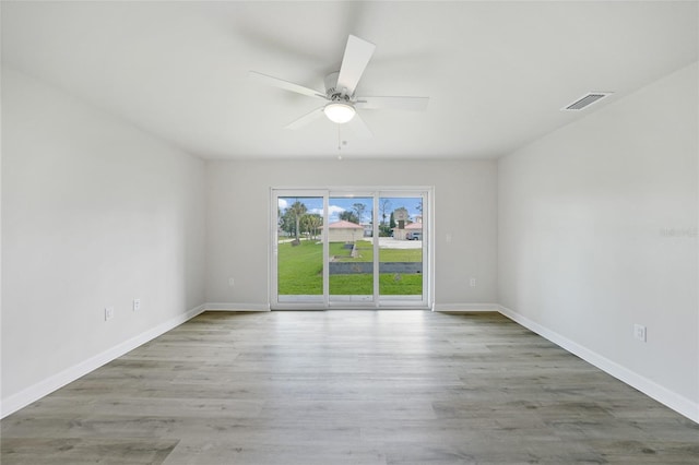 238 Boundary Blvd Unit 3, Rotonda West, FL 33947 - empty room featuring a ceiling fan and wood finished floors