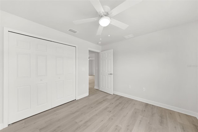 238 Boundary Blvd Unit 3, Rotonda West, FL 33947 - unfurnished bedroom featuring light wood finished floors, a closet, and ceiling fan