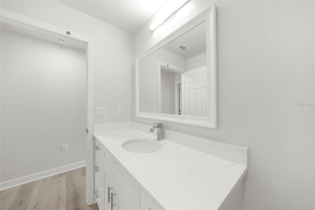 238 Boundary Blvd Unit 3, Rotonda West, FL 33947 - bathroom featuring wood finished floors and vanity