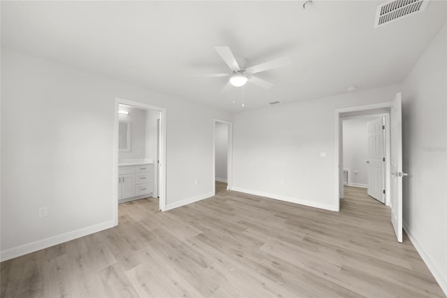 238 Boundary Blvd Unit 3, Rotonda West, FL 33947 - unfurnished bedroom featuring light wood-style floors, ensuite bath, and ceiling fan