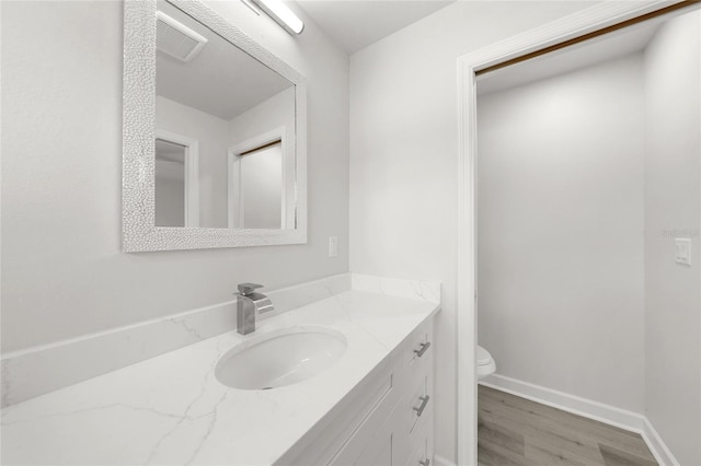 238 Boundary Blvd Unit 3, Rotonda West, FL 33947 - bathroom with vanity and wood finished floors