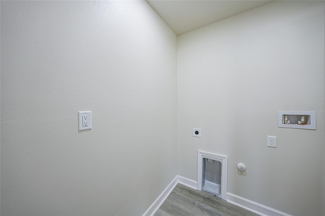 238 Boundary Blvd Unit 3, Rotonda West, FL 33947 - washroom with washer hookup, hookup for an electric dryer, light wood-style floors, and hookup for a gas dryer