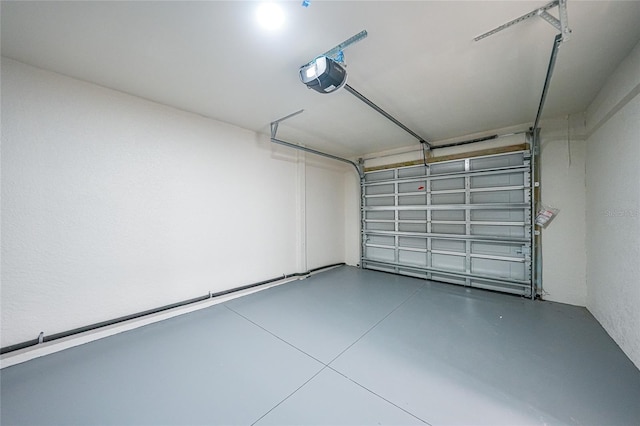 238 Boundary Blvd Unit 3, Rotonda West, FL 33947 - garage featuring a garage door opener