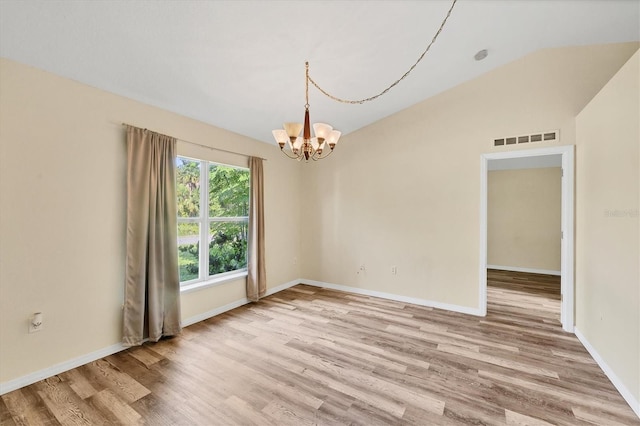 3768 Billingham Ln, North Port, FL 34288 - empty room featuring a chandelier, light wood-style floors, and lofted ceiling