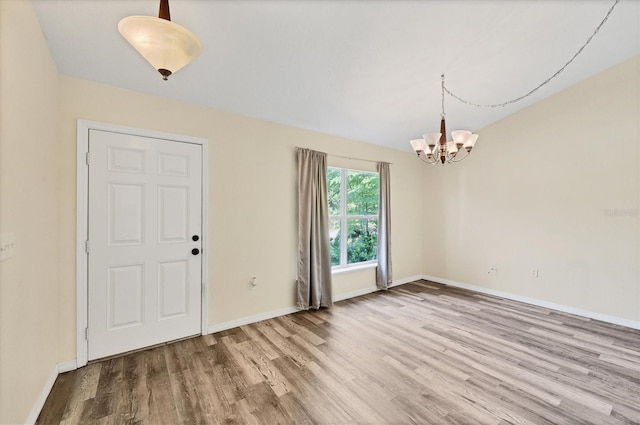 3768 Billingham Ln, North Port, FL 34288 - foyer featuring wood finished floors and a chandelier