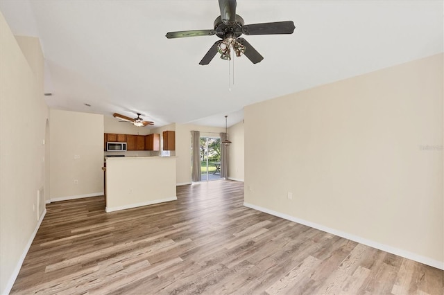 3768 Billingham Ln, North Port, FL 34288 - unfurnished living room featuring light wood-type flooring and a ceiling fan
