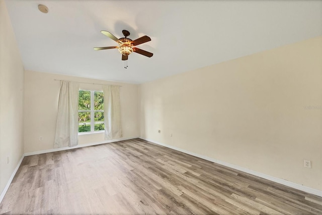 3768 Billingham Ln, North Port, FL 34288 - spare room featuring wood finished floors, ceiling fan, and a smoke detector