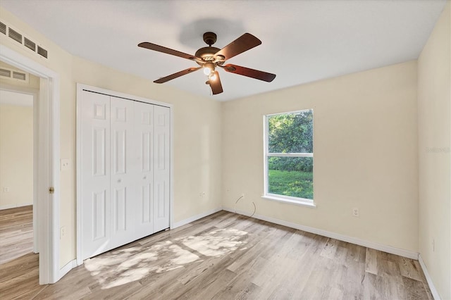 3768 Billingham Ln, North Port, FL 34288 - unfurnished bedroom featuring wood finished floors, a closet, and a ceiling fan