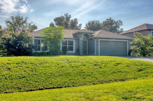 3768 Billingham Ln, North Port, FL 34288 - ranch-style house featuring an attached garage, driveway, stucco siding, a front lawn, and roof with shingles