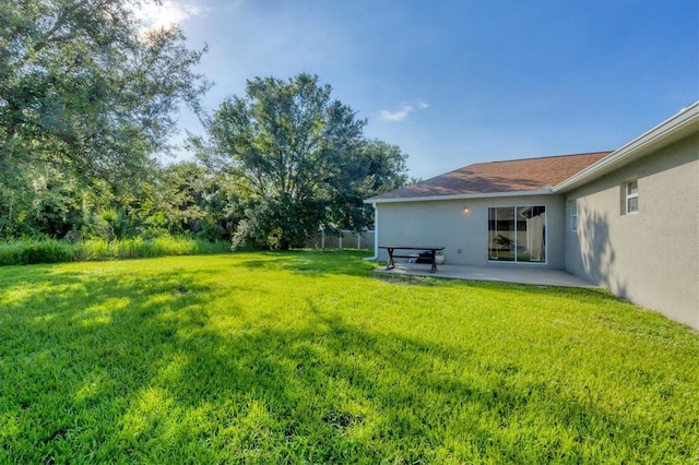 3768 Billingham Ln, North Port, FL 34288 - view of green lawn with a patio area