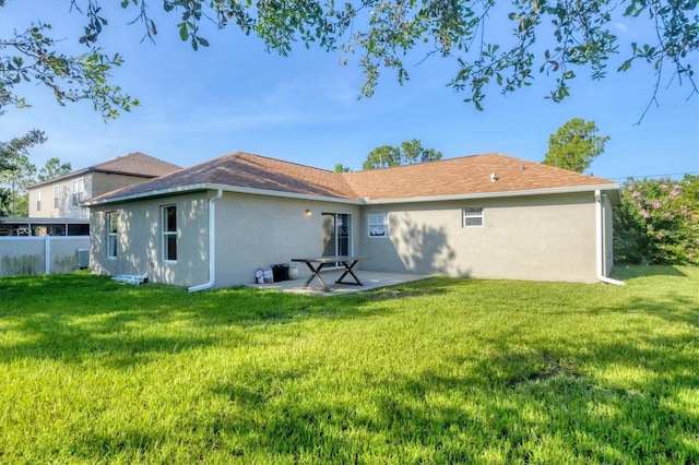 3768 Billingham Ln, North Port, FL 34288 - rear view of house featuring stucco siding and a patio