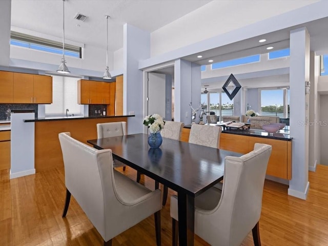 8041 Bay Pointe Dr, Englewood, FL 34224 - dining area featuring light wood-style floors and recessed lighting