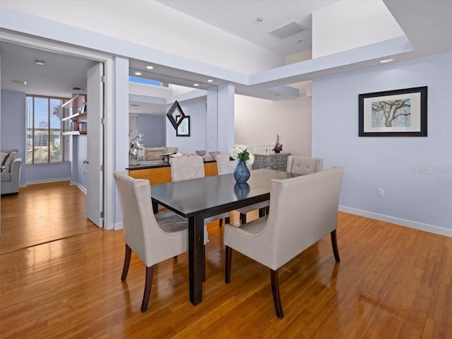 8041 Bay Pointe Dr, Englewood, FL 34224 - dining room featuring light wood-style floors and baseboards