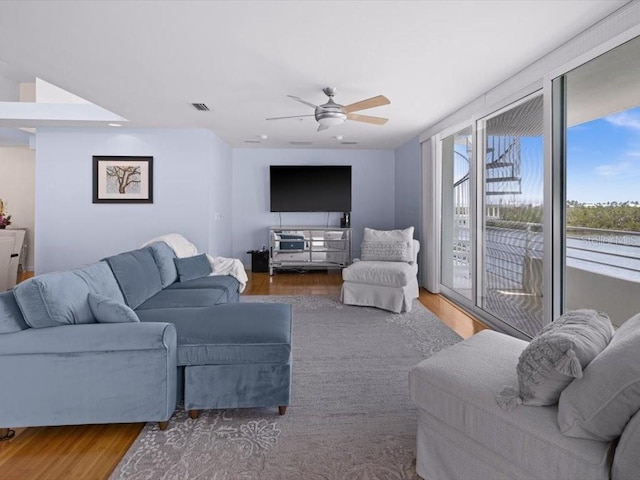 8041 Bay Pointe Dr, Englewood, FL 34224 - living room with a ceiling fan and wood finished floors