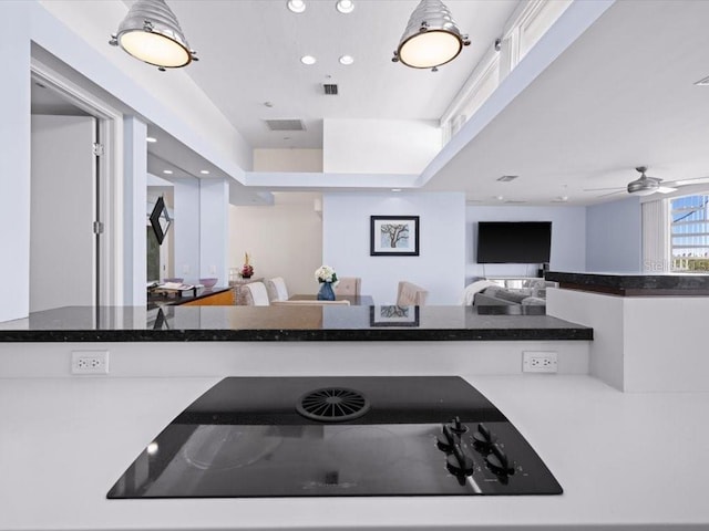 8041 Bay Pointe Dr, Englewood, FL 34224 - kitchen featuring black electric cooktop, recessed lighting, open floor plan, and ceiling fan