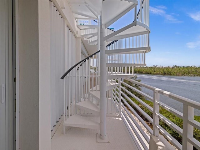 8041 Bay Pointe Dr, Englewood, FL 34224 - staircase with a water view