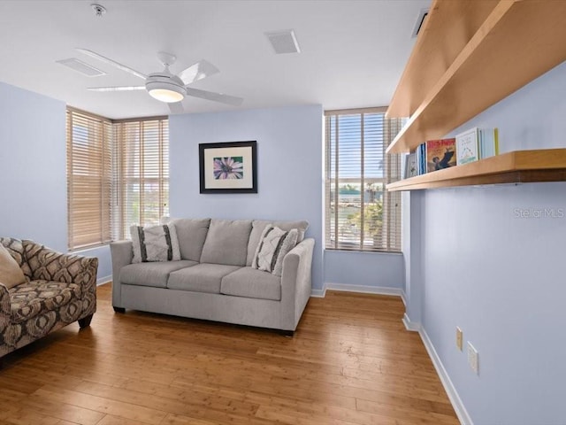 8041 Bay Pointe Dr, Englewood, FL 34224 - living area with a ceiling fan and hardwood / wood-style flooring