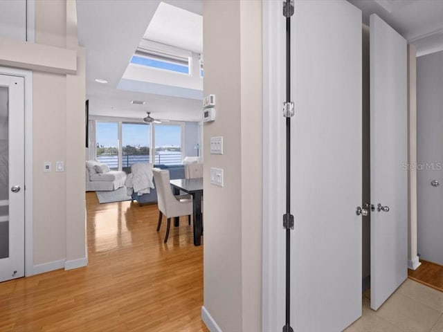 8041 Bay Pointe Dr, Englewood, FL 34224 - corridor with light wood-style floors and a water view