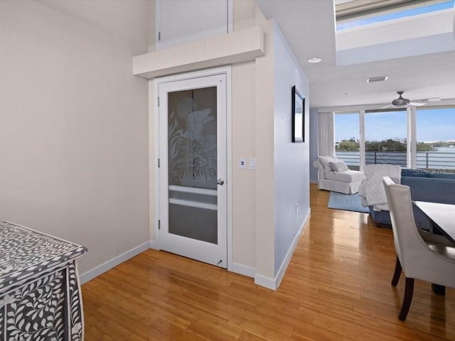 8041 Bay Pointe Dr, Englewood, FL 34224 - entryway with light wood-style flooring and a water view