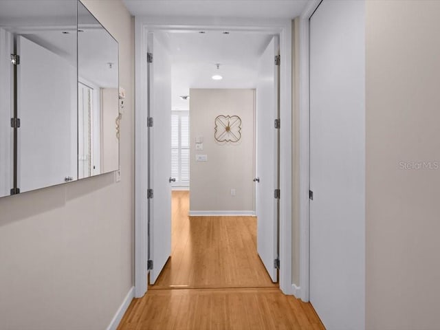 8041 Bay Pointe Dr, Englewood, FL 34224 - hallway with light wood-type flooring and recessed lighting
