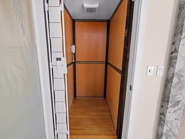 8041 Bay Pointe Dr, Englewood, FL 34224 - elevator featuring wood finished floors