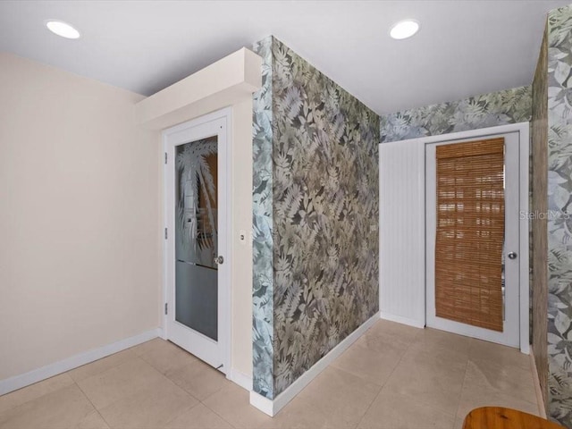 8041 Bay Pointe Dr, Englewood, FL 34224 - tiled entrance foyer with wallpapered walls and recessed lighting