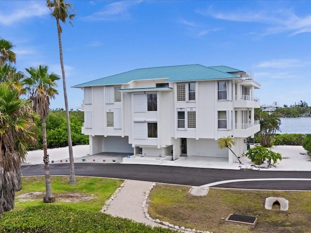 8041 Bay Pointe Dr, Englewood, FL 34224 - view of building exterior with a water view